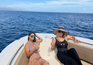 Guests enjoying champagne aboard Wahine Moana