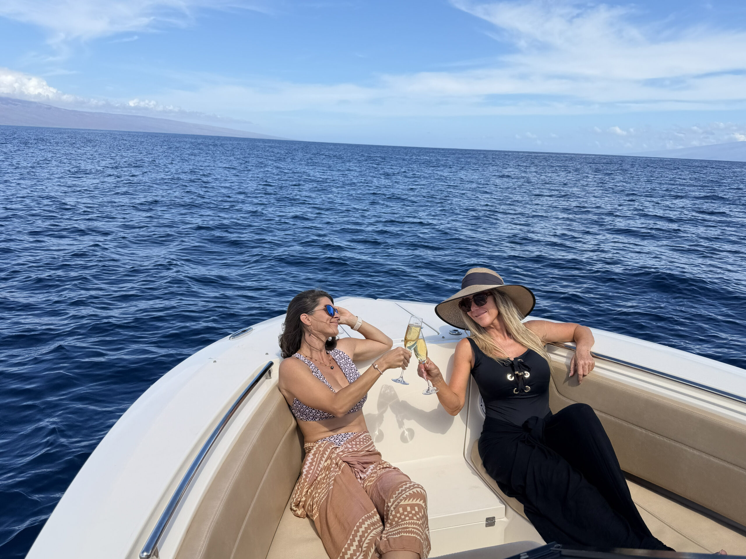 Guests enjoying champagne aboard Wahine Moana